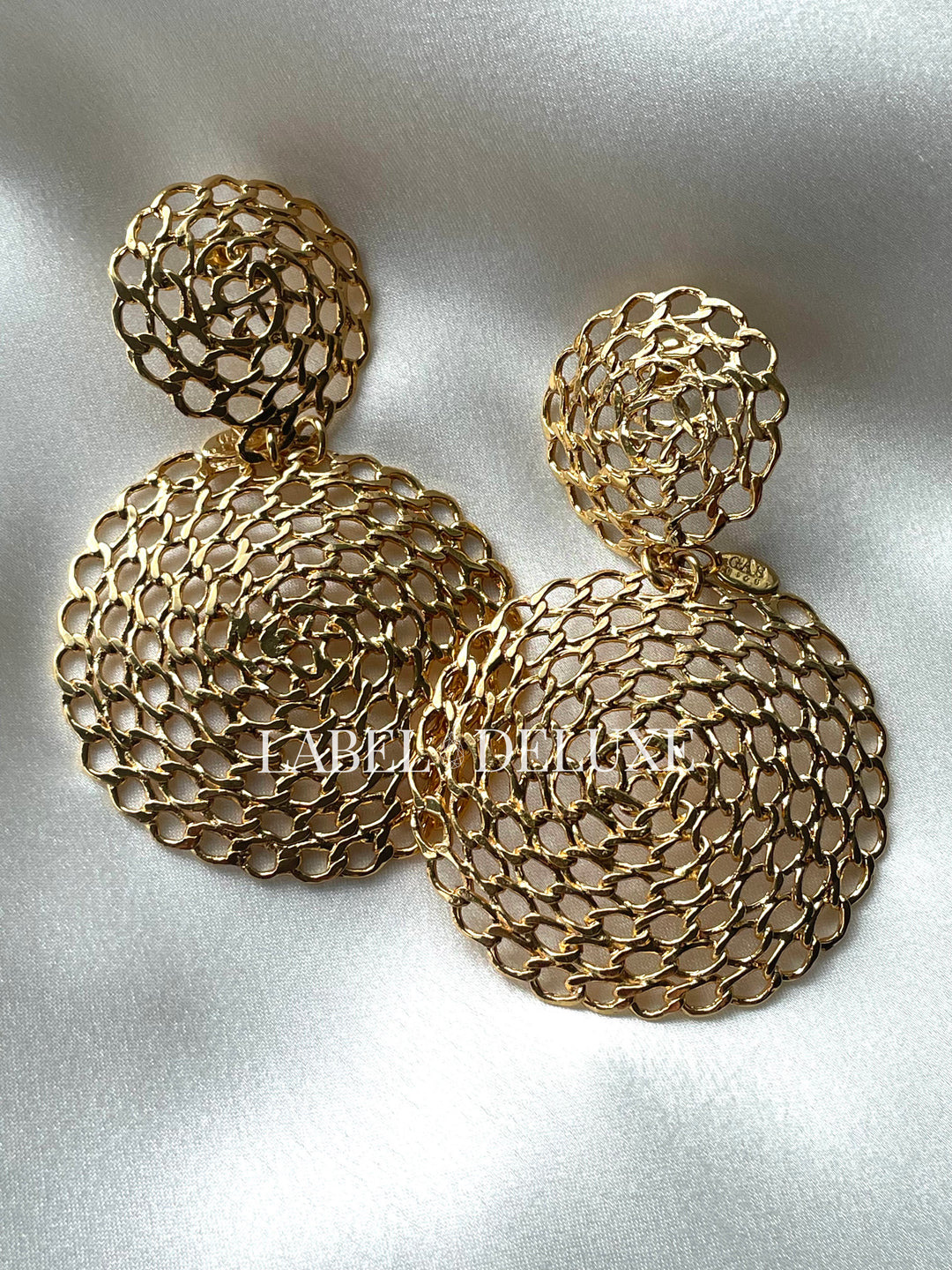 Gas Bijoux Onde Gourmette boucles d'oreilles goudkleurige statement oorbellen met opengewerkte gourmette schakels en ronde hanger.
