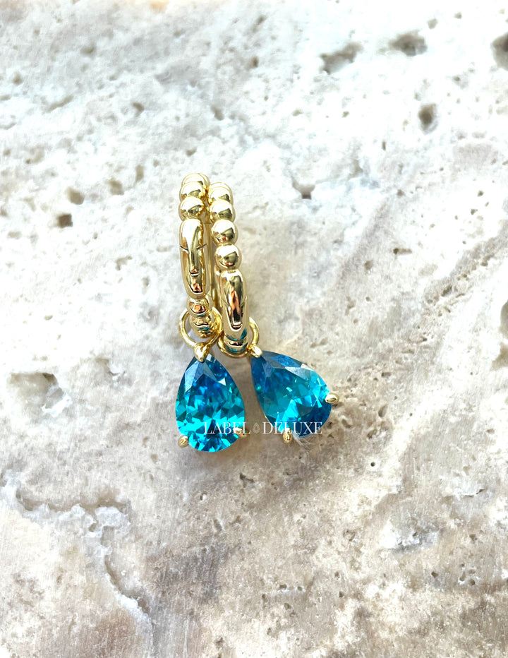 Karma Jewelry A106GP_LB - Hinged Hoops Zirconia Anna - Oorbellen Dames - 925 Sterling Zilver - 14K Gouden Plating - Helder Blauw - 26 MM